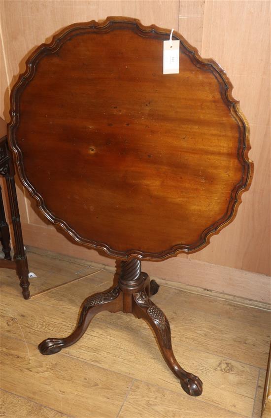 A George III style carved mahogany piecrust tilt-top tea table